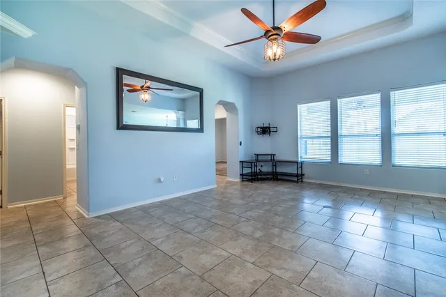 a view of kitchen with microwave a stove and a refrigerator