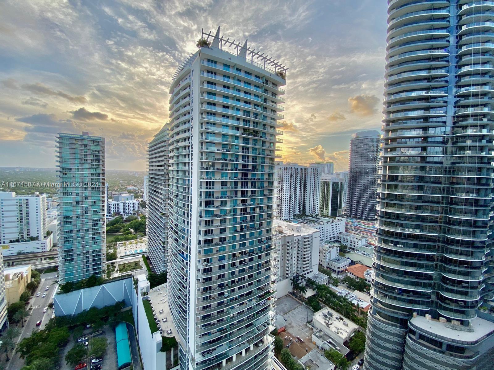 1080 Brickell Avenue, Unit 3107 Miami, FL 33131 - Photo 2 of 19 a city view with tall buildings