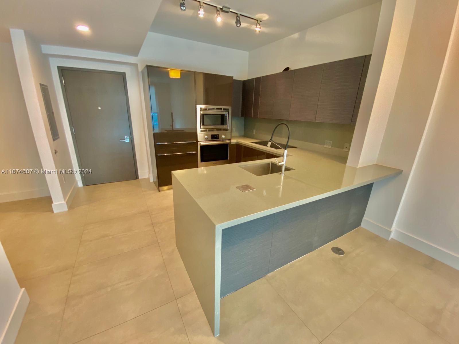 1080 Brickell Avenue, Unit 3107 Miami, FL 33131 - Photo 4 of 19 a bathroom with a sink and a tub