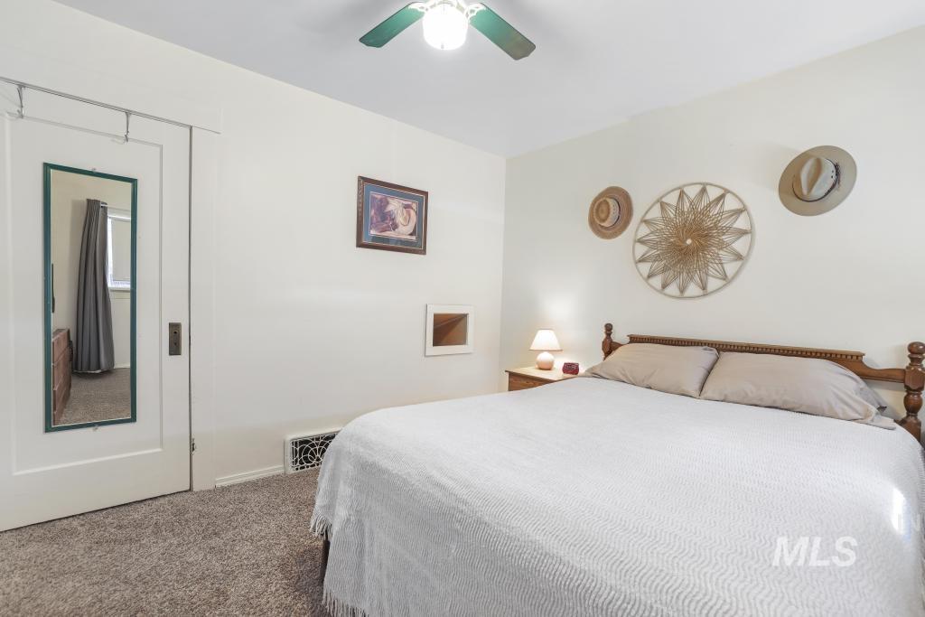 3985 North 2300 E Road Filer, ID 83328 - Photo 16 of 35 Bedroom featuring carpet and a ceiling fan
