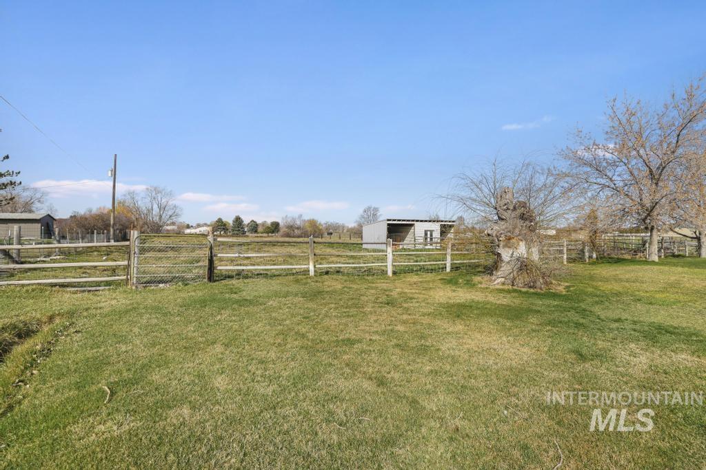 3985 North 2300 E Road Filer, ID 83328 - Photo 30 of 35 View of yard with an outdoor structure and a rural view