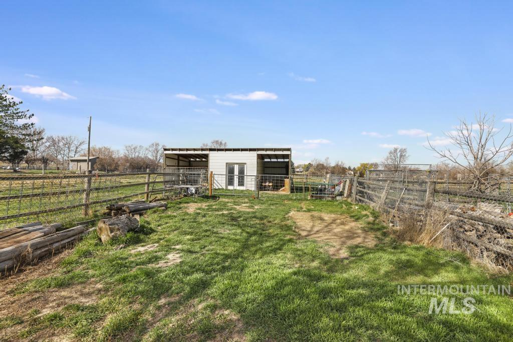 3985 North 2300 E Road Filer, ID 83328 - Photo 31 of 35 View of yard with an outdoor structure, a view of rural / pastoral area, and an exterior structure