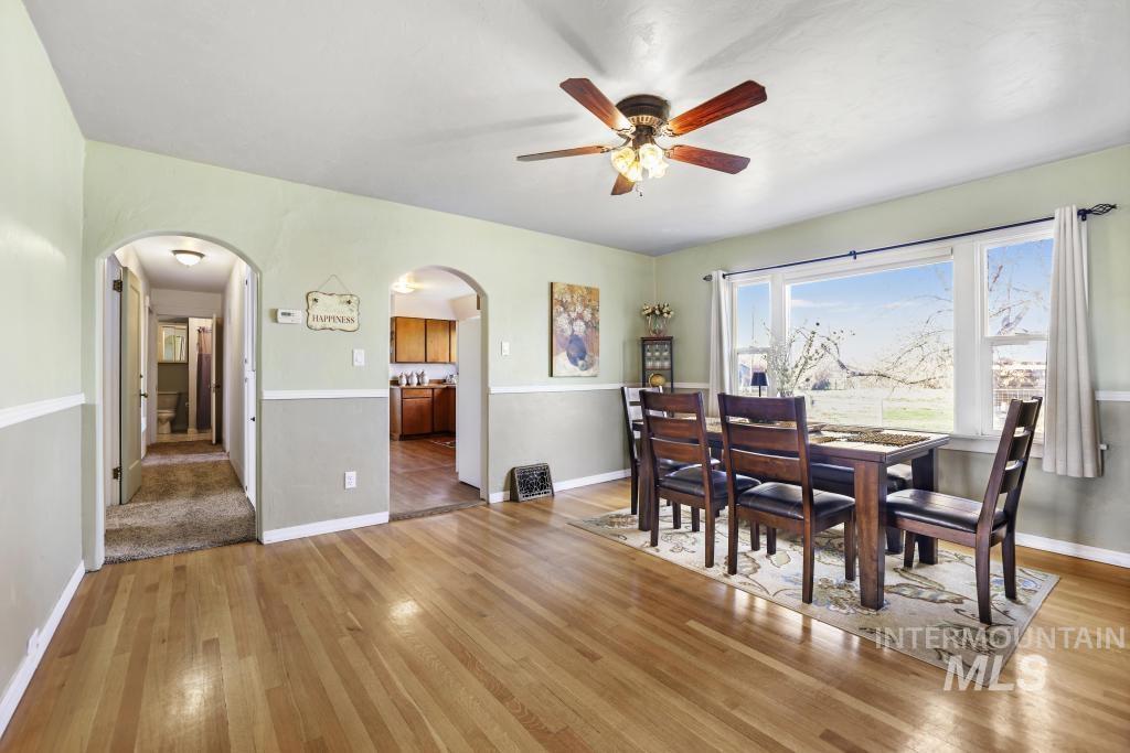 3985 North 2300 E Road Filer, ID 83328 - Photo 7 of 35 Dining room with light wood finished floors and a ceiling fan