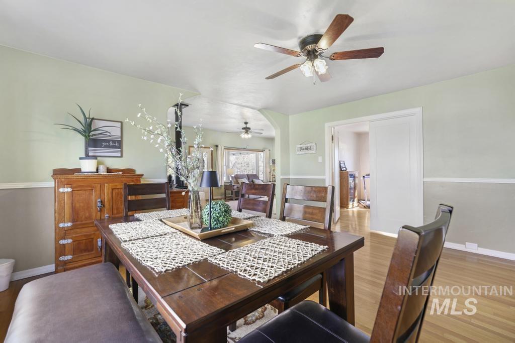 3985 North 2300 E Road Filer, ID 83328 - Photo 9 of 35 Dining space with wood finished floors and ceiling fan