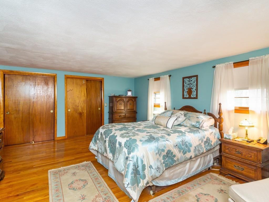 48 MacDonald Circle Walpole, MA 02081 - Photo 16 of 41 a bedroom with a bed and a dresser