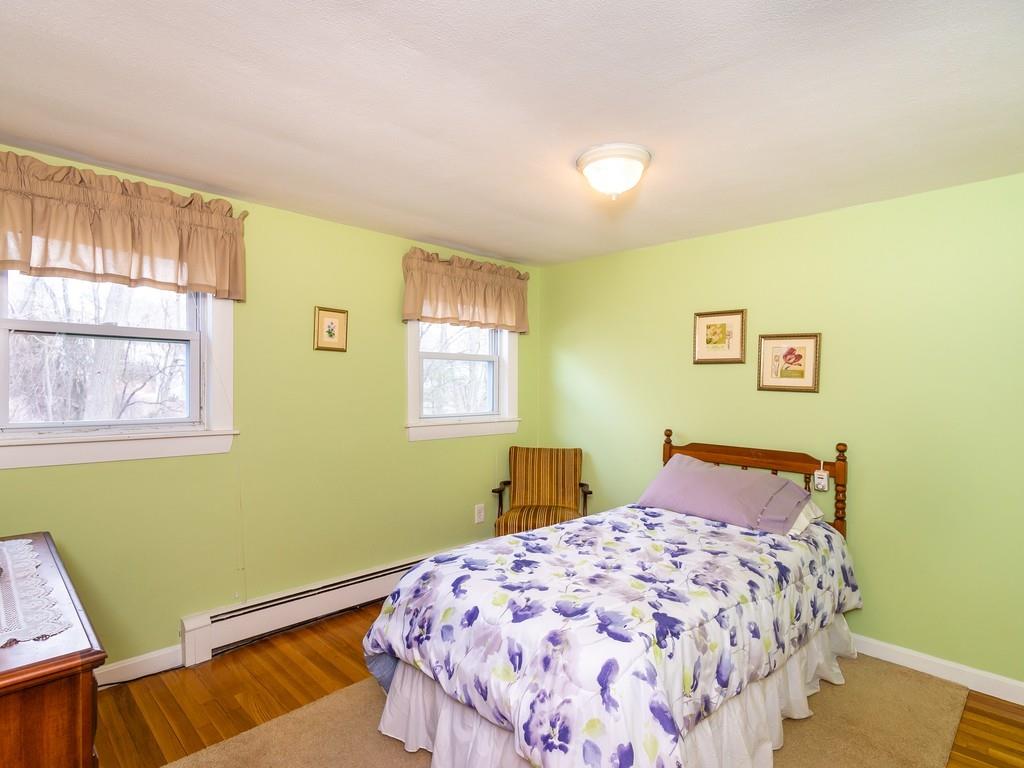 48 MacDonald Circle Walpole, MA 02081 - Photo 20 of 41 a bedroom with a bed and wooden floor
