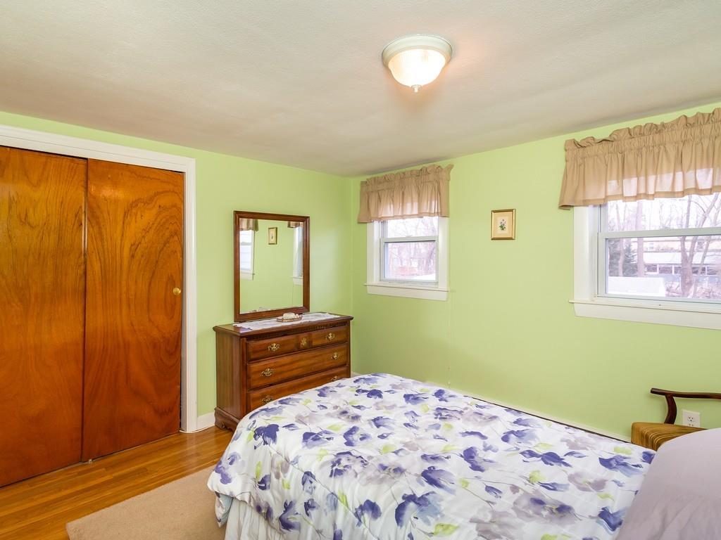 48 MacDonald Circle Walpole, MA 02081 - Photo 21 of 41 a bedroom with a bed and a window