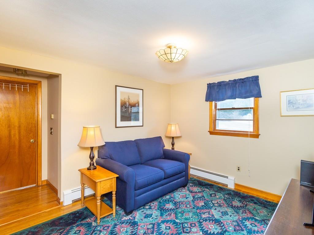 48 MacDonald Circle Walpole, MA 02081 - Photo 22 of 41 a living room with furniture and a rug
