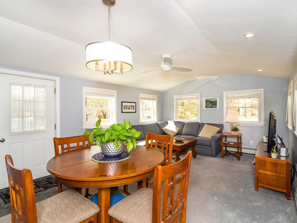 48 MacDonald Circle Walpole, MA 02081 - Photo 26 of 41 a view of a dining room with furniture window and wooden floor
