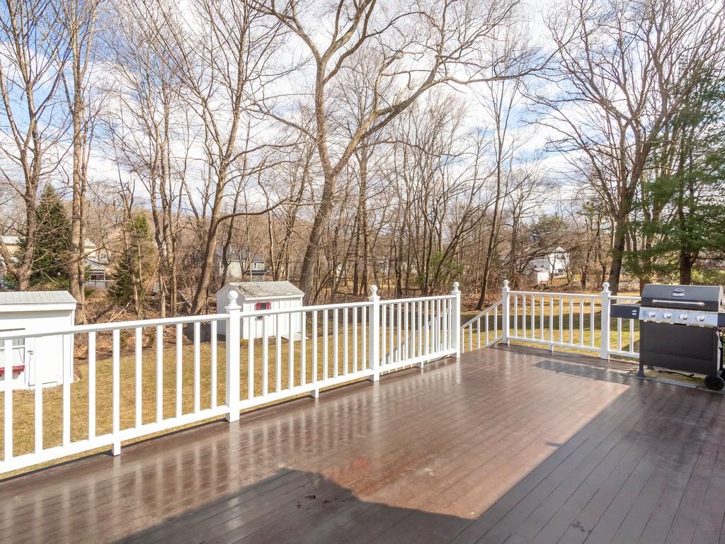 48 MacDonald Circle Walpole, MA 02081 - Photo 35 of 41 a view of a deck with a yard and trees