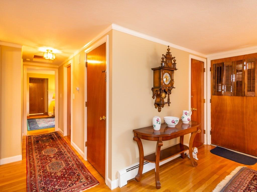 48 MacDonald Circle Walpole, MA 02081 - Photo 4 of 41 a view of a room with a table and chairs