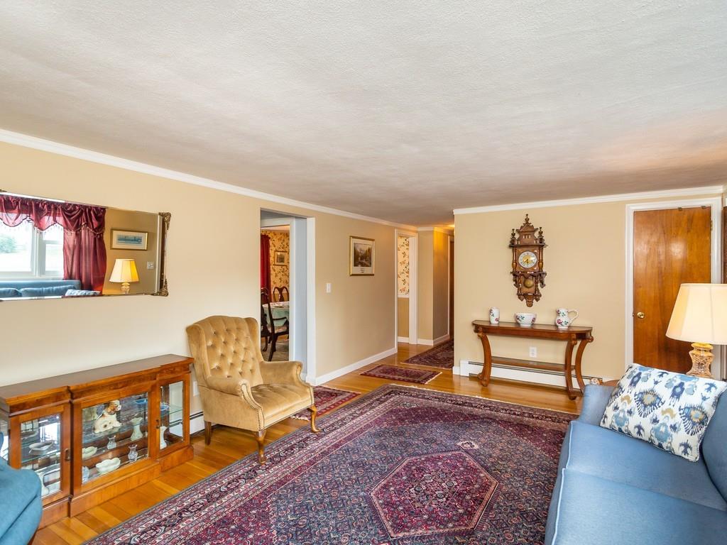 48 MacDonald Circle Walpole, MA 02081 - Photo 7 of 41 a living room with furniture and wooden floor