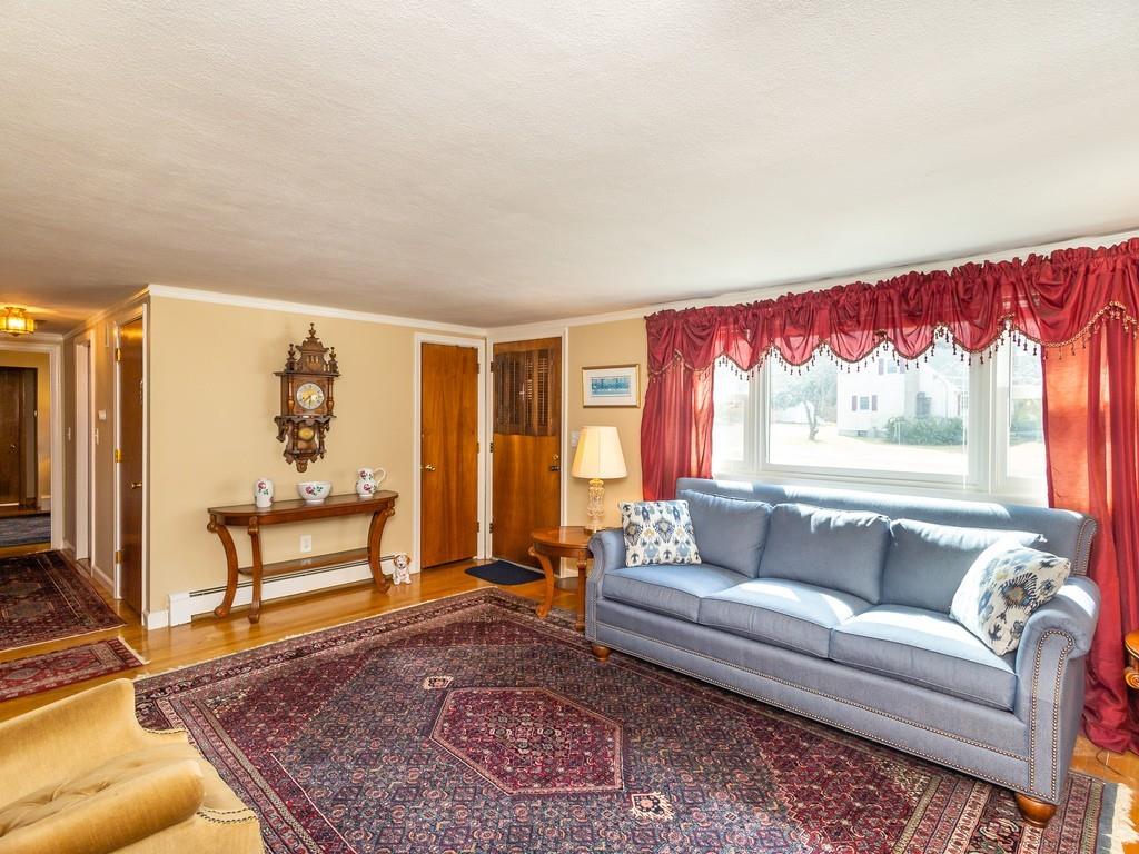 48 MacDonald Circle Walpole, MA 02081 - Photo 8 of 41 a living room with furniture and a rug