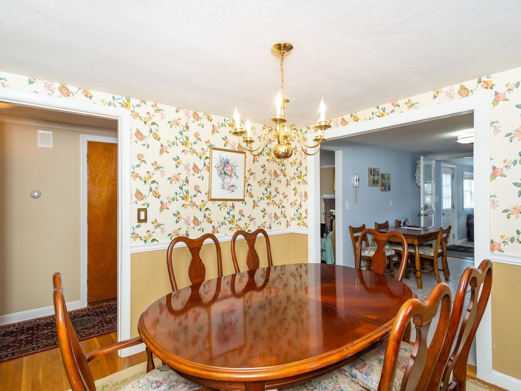 48 MacDonald Circle Walpole, MA 02081 - Photo 10 of 41 a view of a dining room with furniture wooden floor and chandelier