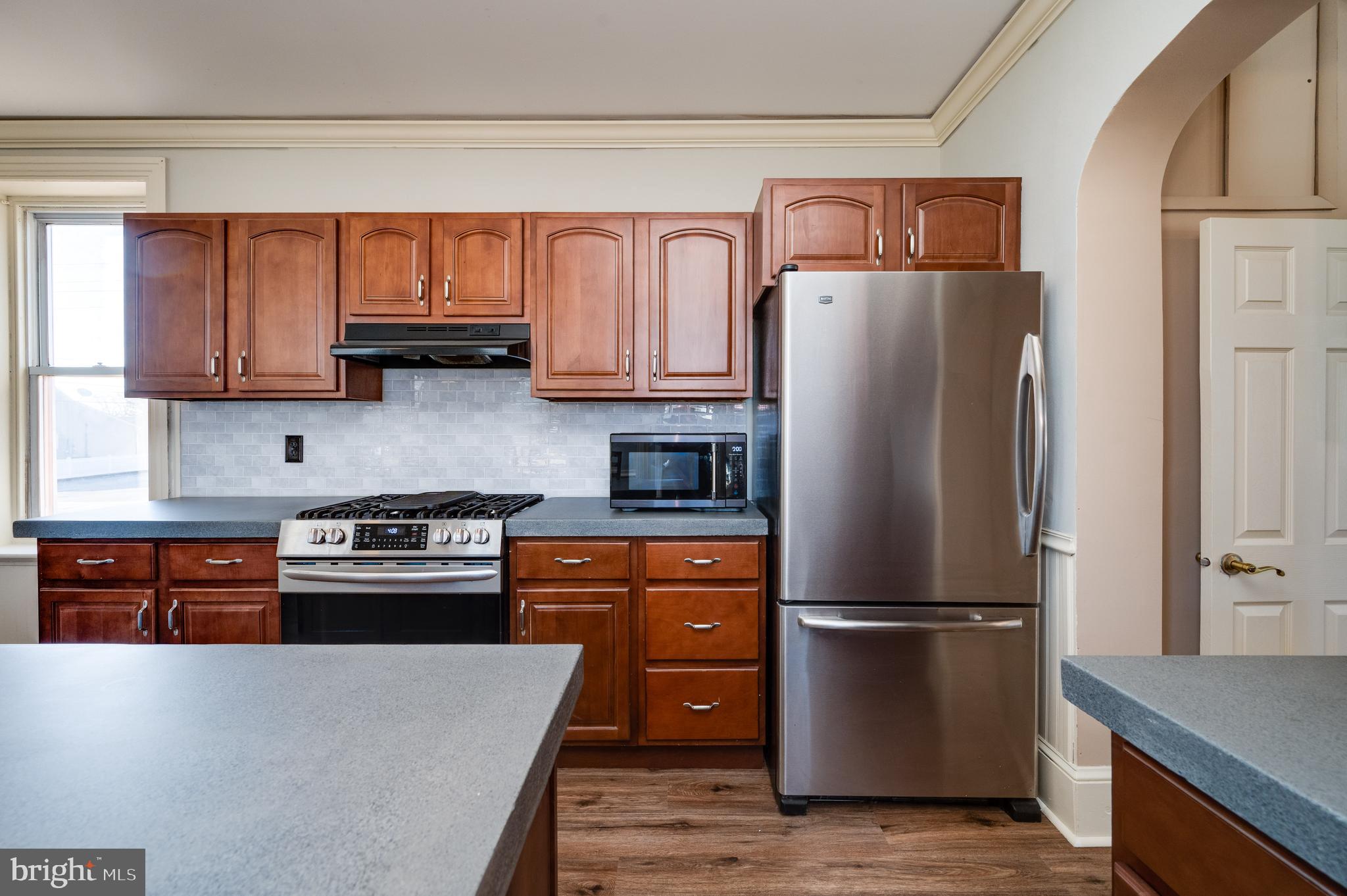 800 Mount Laurel Road Temple, PA 19560 - Photo 18 of 42 a kitchen with stainless steel appliances granite countertop a refrigerator stove and a sink