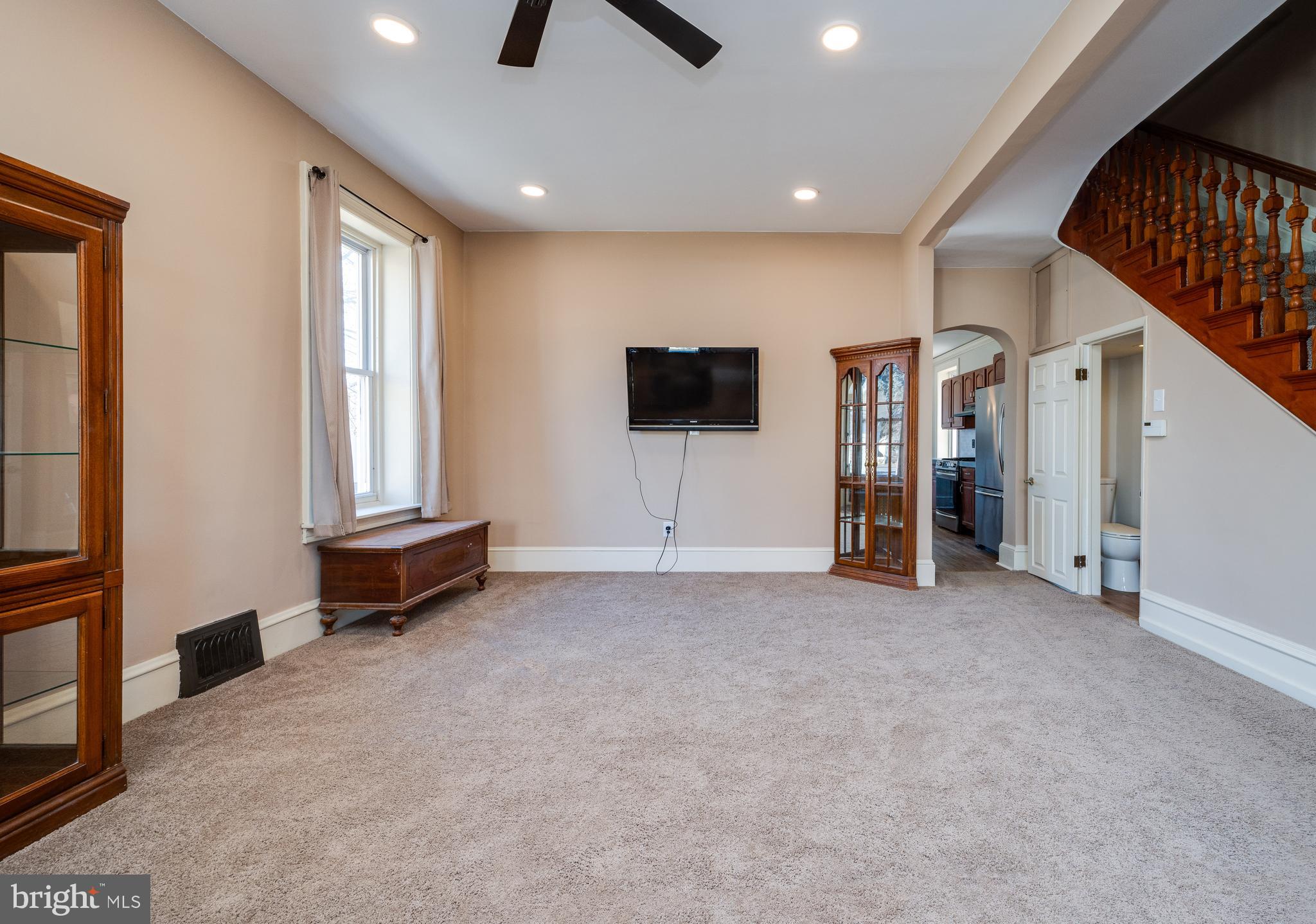800 Mount Laurel Road Temple, PA 19560 - Photo 10 of 42 a view of a livingroom with entryway a ceiling fan and windows