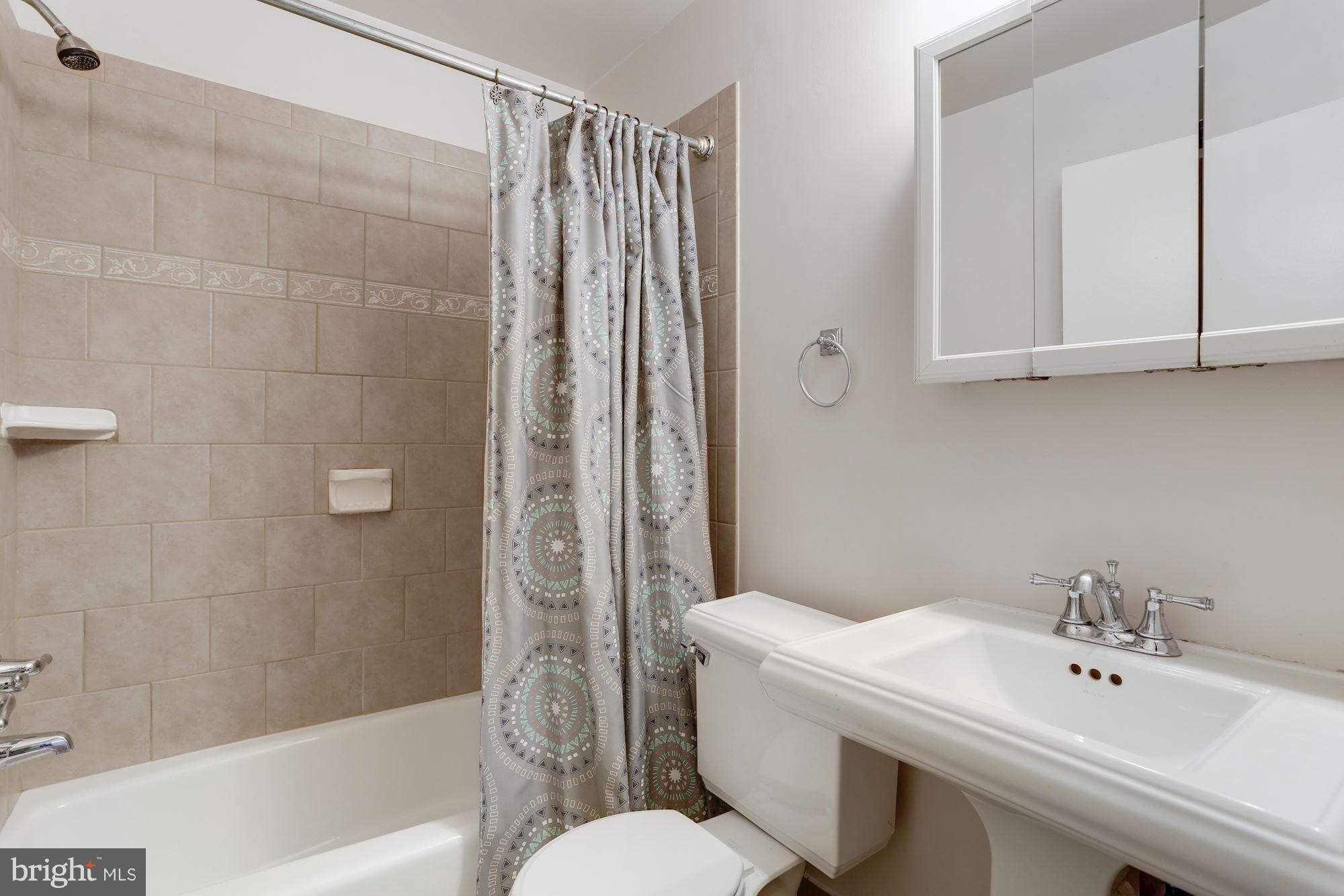 8621 Valleyfield Road Lutherville-Timonium, MD 21093 - Photo 22 of 29 Remodeled Main level full bath w/ ceramic tile