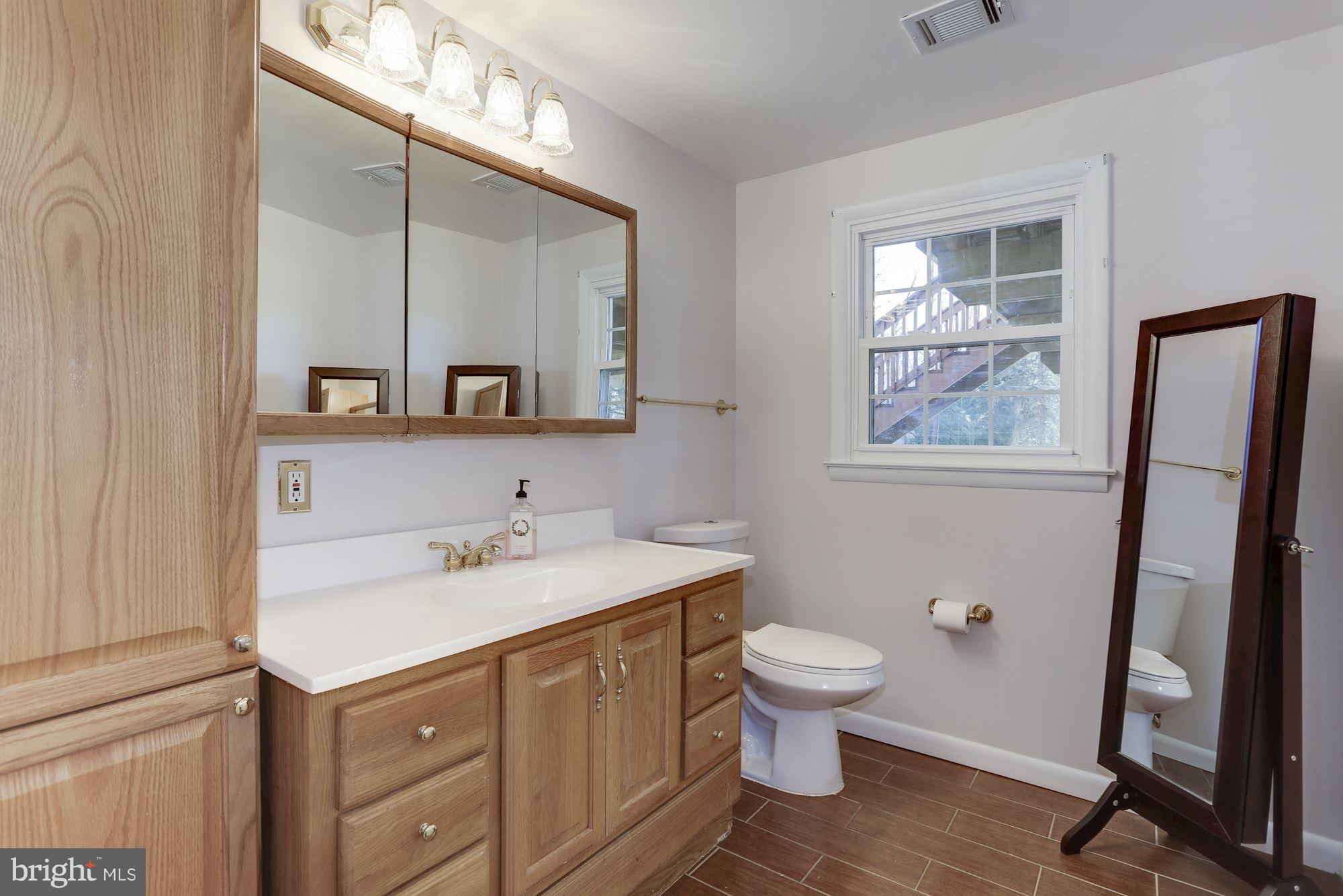 8621 Valleyfield Road Lutherville-Timonium, MD 21093 - Photo 26 of 29 Lower level powder room w/newer fixtures