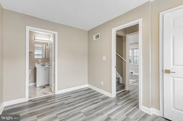 a view of a bathroom from a hallway