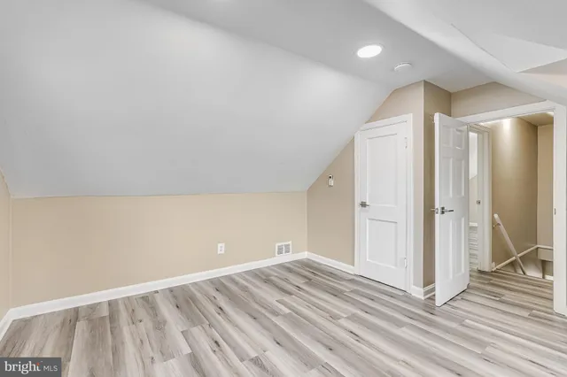 a view of a livingroom with wooden floor and closet