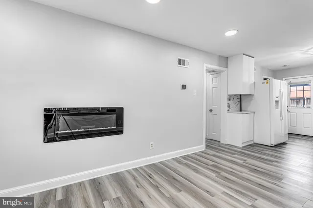 a view of a livingroom with wooden floor