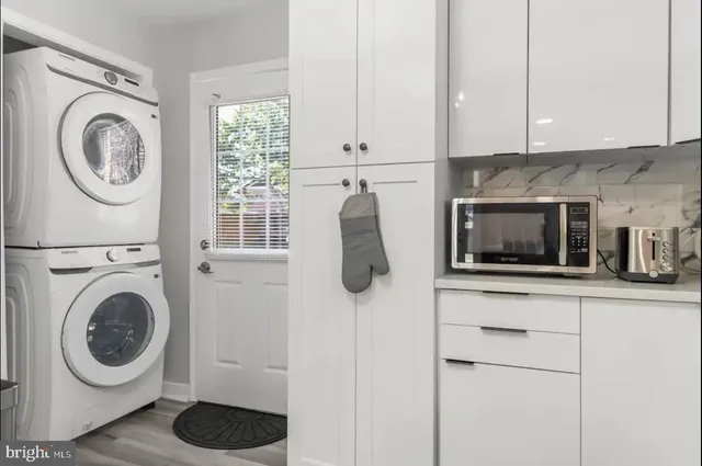 a kitchen with a washer and dryer