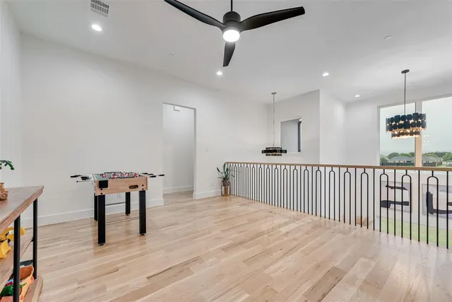 a bedroom with furniture and wooden floor