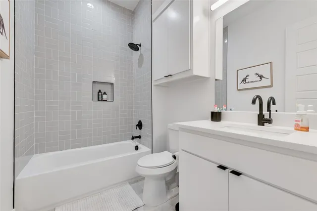 a bathroom with a sink a toilet and a bathtub