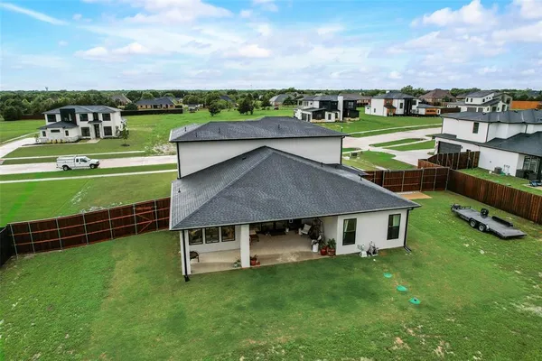 an aerial view of a house and outdoor space