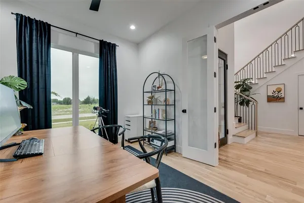 a view of a livingroom with furniture and hardwood floor