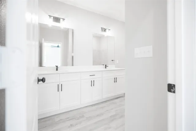 a white toilet sitting next to a shower