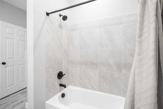 a bathroom with a shower curtain