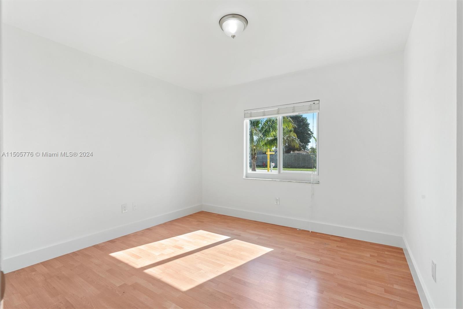 11126 Delta Circle Boca Raton, FL 33428 - Photo 14 of 22 an empty room with a window