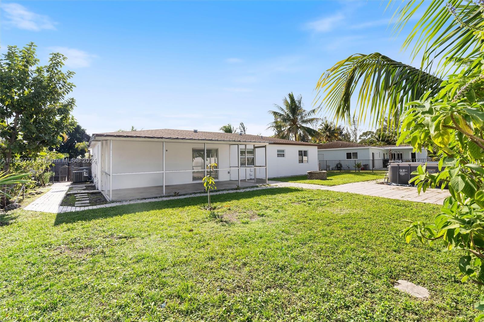 11126 Delta Circle Boca Raton, FL 33428 - Photo 21 of 22 a view of a house with a swimming pool and a chair