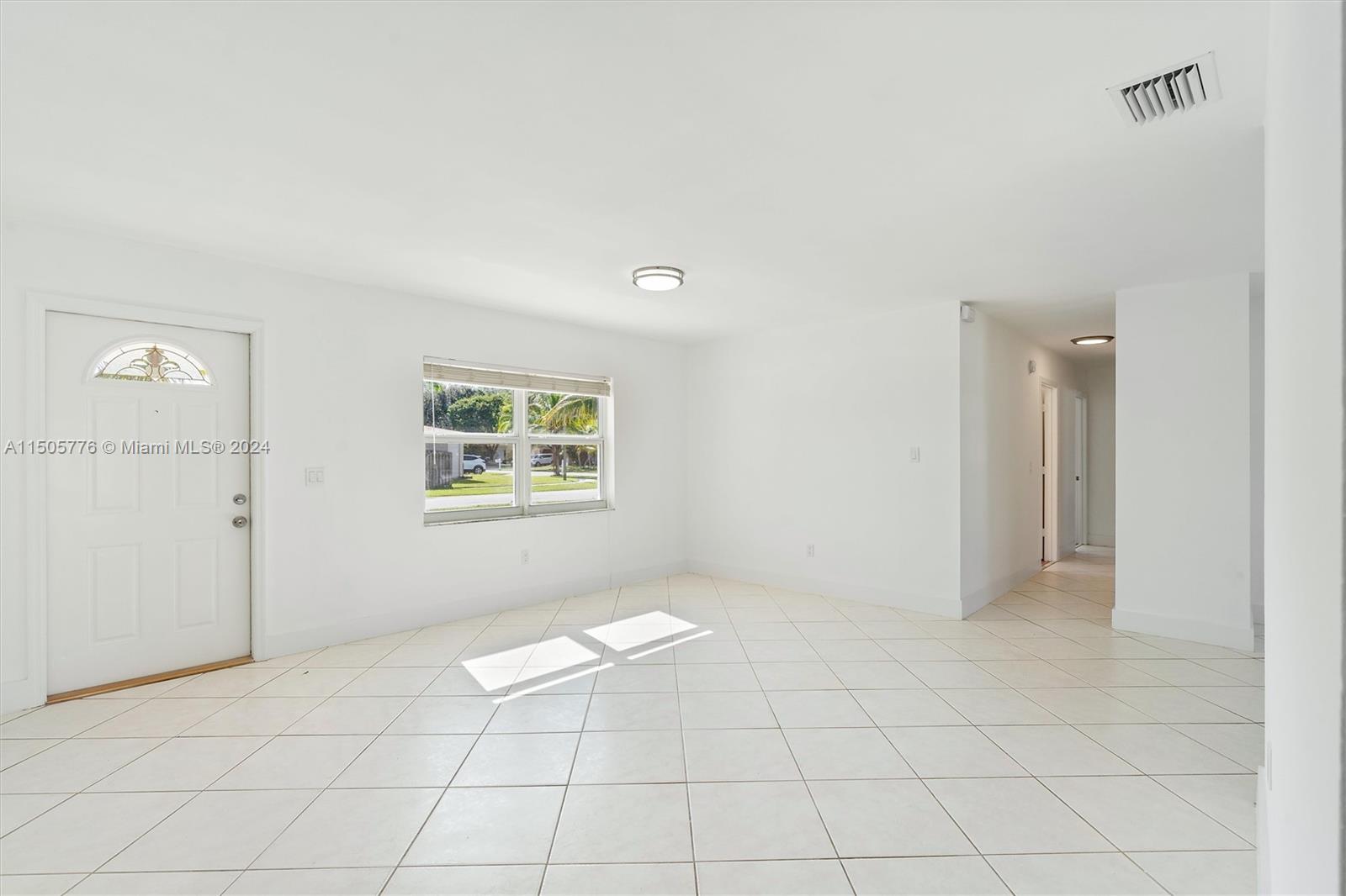 11126 Delta Circle Boca Raton, FL 33428 - Photo 5 of 22 a view of an empty room and window