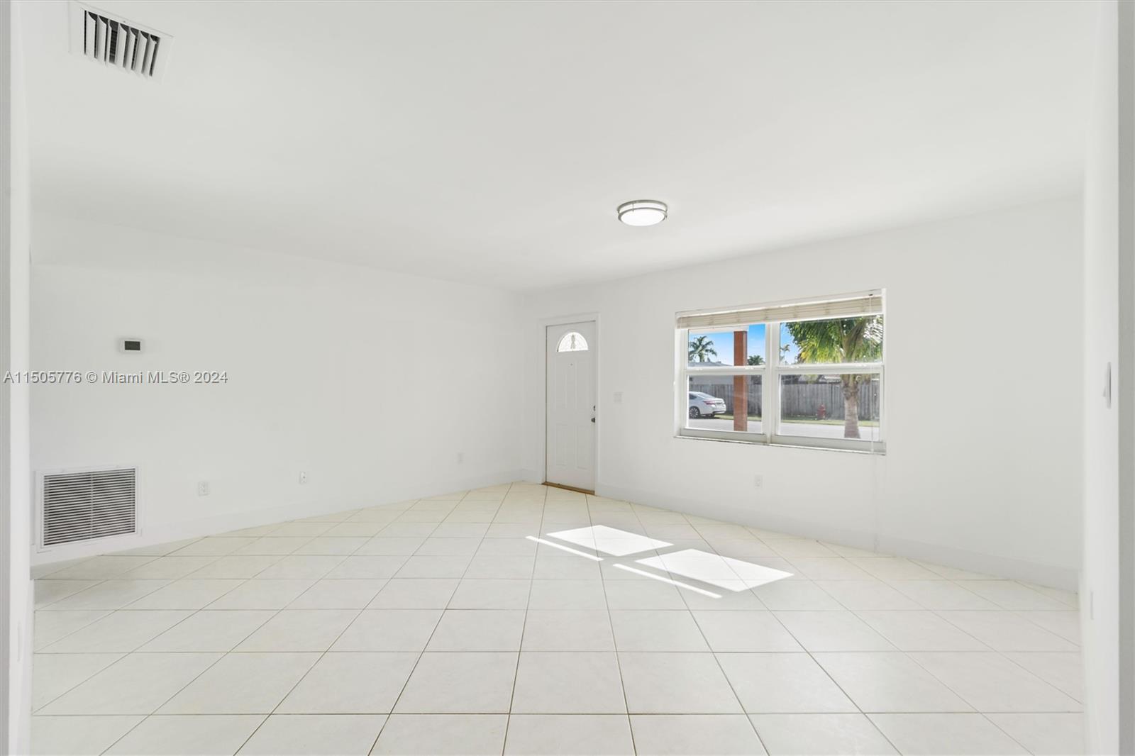 11126 Delta Circle Boca Raton, FL 33428 - Photo 6 of 22 an empty room with windows