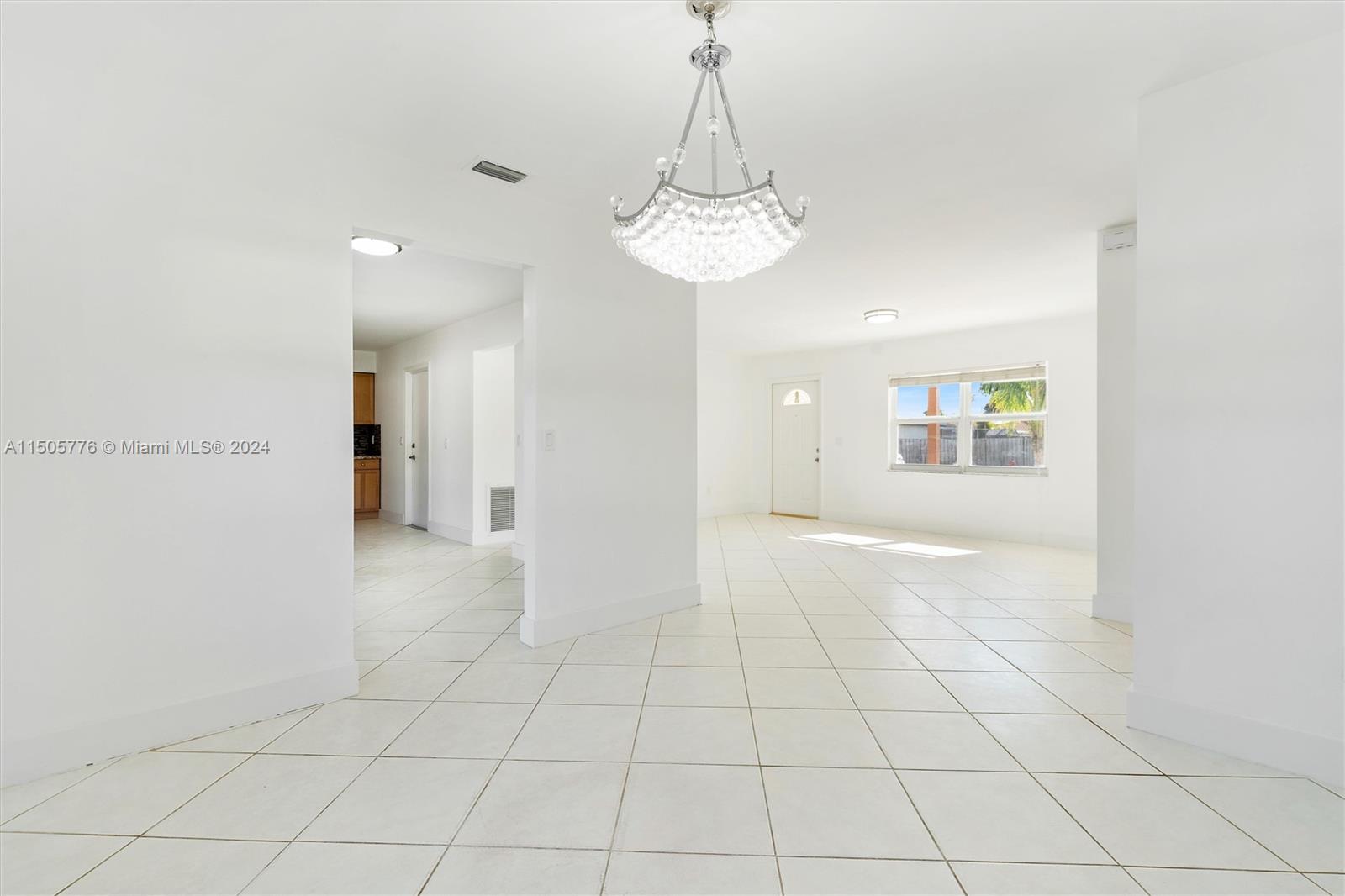 11126 Delta Circle Boca Raton, FL 33428 - Photo 8 of 22 a view of an empty room and a chandelier fan