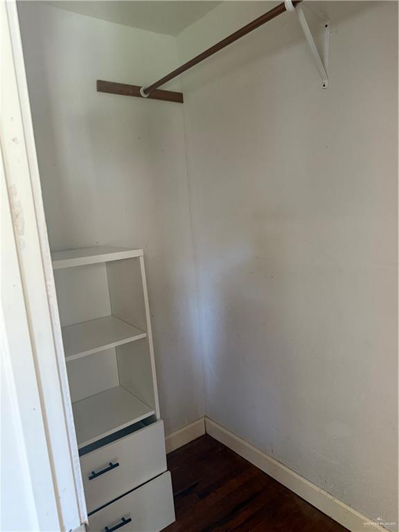 708 North 6th Street McAllen, TX 78501 - Photo 12 of 27 Spacious closet featuring dark wood-style floors