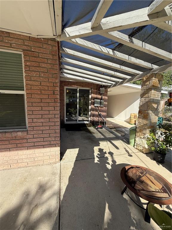 708 North 6th Street McAllen, TX 78501 - Photo 19 of 27 View of patio / terrace with an outdoor fire pit