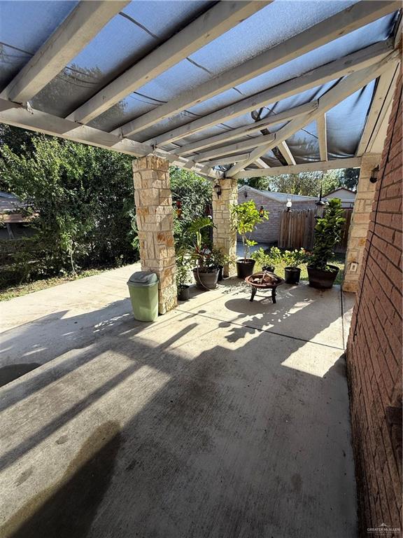 708 North 6th Street McAllen, TX 78501 - Photo 22 of 27 View of patio / terrace featuring a fire pit and a pergola