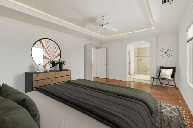 a bedroom with a bed and a dresser