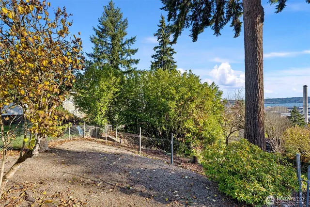 a view of a chair and table in front of house