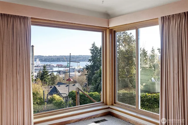 a view of a room with a large window