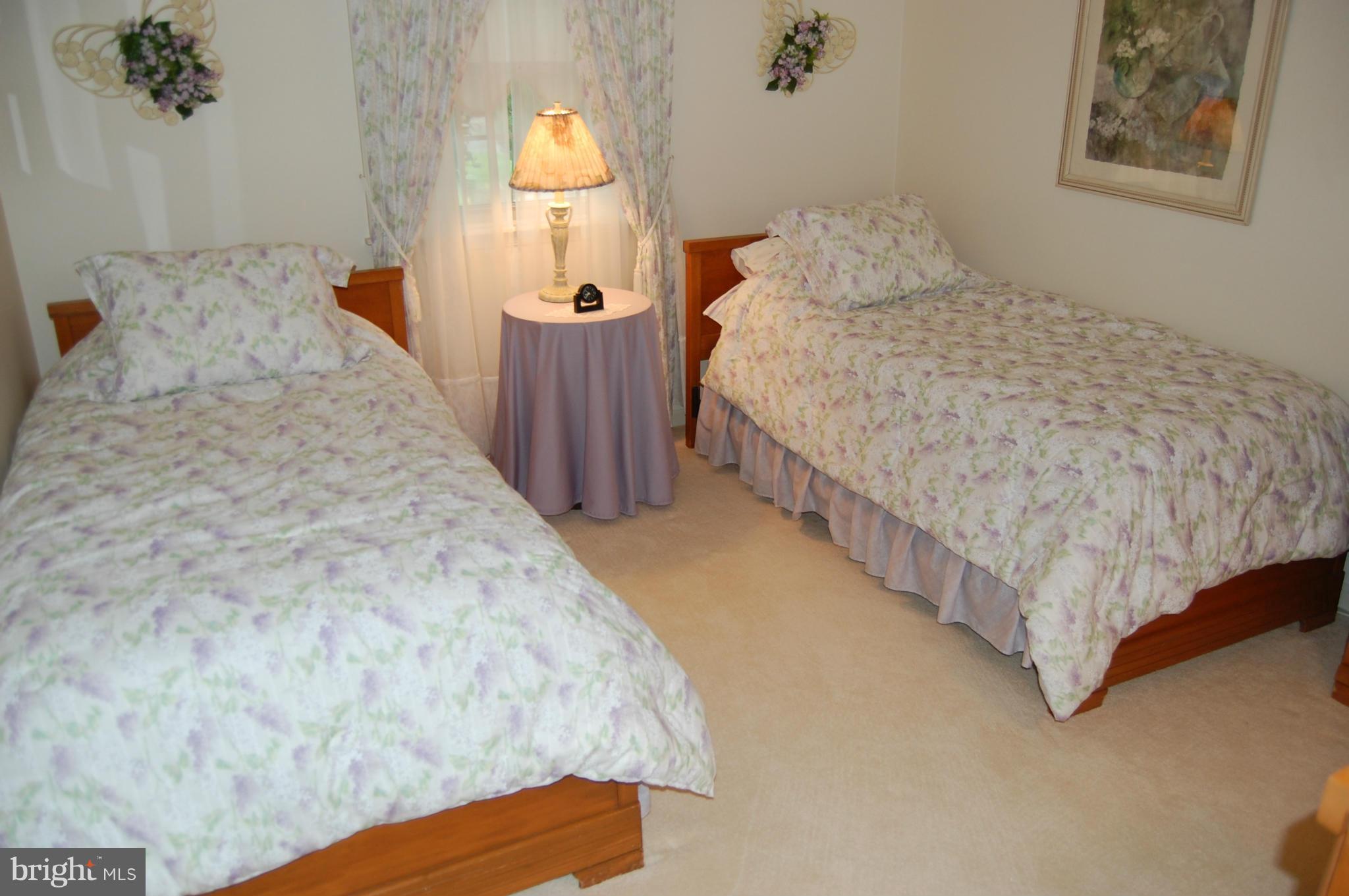 2209 Parallel Lane Silver Spring, MD 20904 - Photo 13 of 30 a bed sitting in a bedroom next to a window