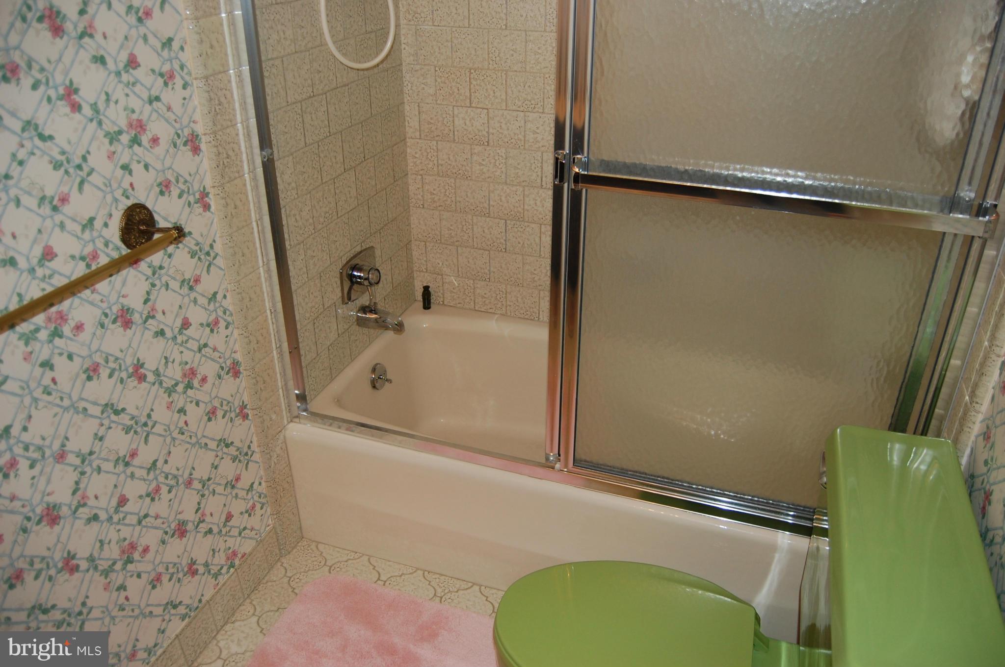 2209 Parallel Lane Silver Spring, MD 20904 - Photo 14 of 30 a bathroom with a granite countertop shower and a sink