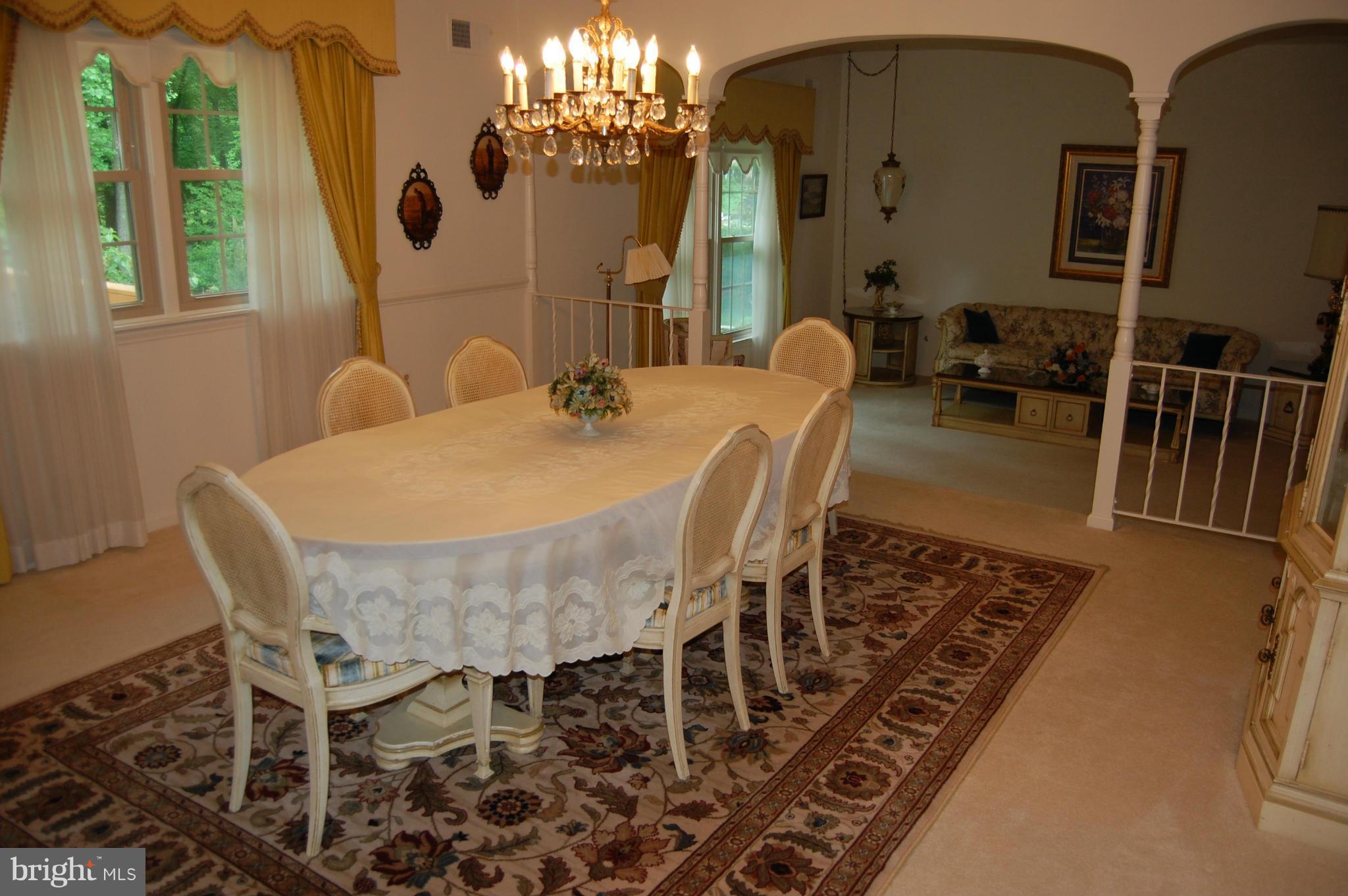 2209 Parallel Lane Silver Spring, MD 20904 - Photo 7 of 30 a view of a dining room with furniture and a chandelier