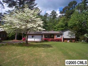 3079 Lake Shore Road South Denver, NC 28037 - Photo 1 of 8 a view of a house with a yard porch and sitting area