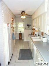 3079 Lake Shore Road South Denver, NC 28037 - Photo 4 of 8 a kitchen with a sink refrigerator and cabinets