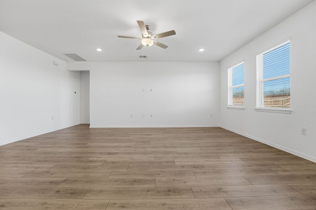 1712 Lorant Lane Pflugerville, TX 78660 - Photo 5 of 36 wooden floor in an empty room with a window
