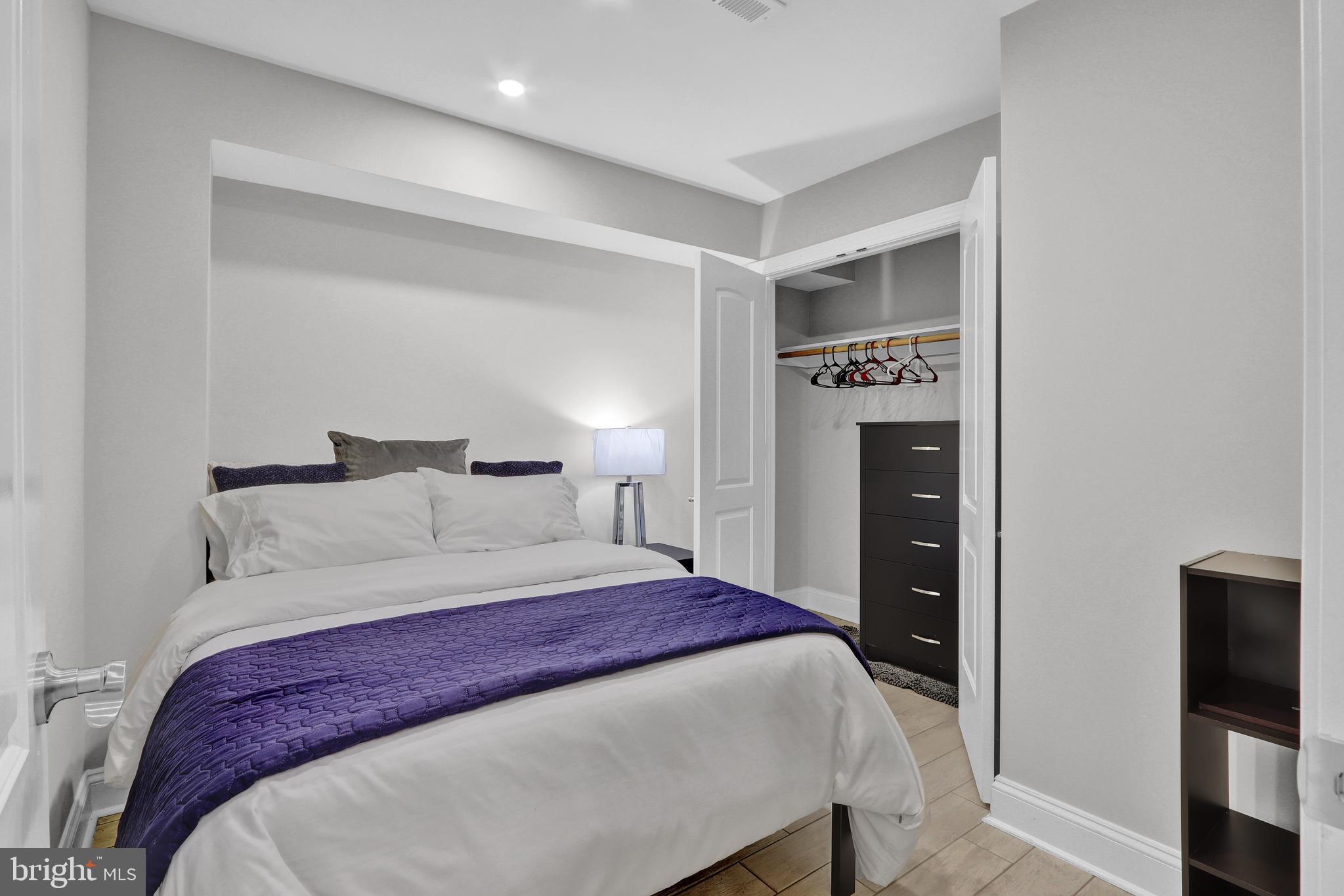 1167 Morse Street Northeast, Unit B1 Washington, DC 20002 - Photo 11 of 18 a bedroom with a bed and a television